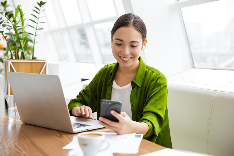 Person using a timesheet application on a laptop