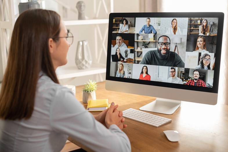 Woman in a virtual meeting demonstrating how OfficeSeries Timesheet allows administrators and managers to easily manage teams and groups within the organization