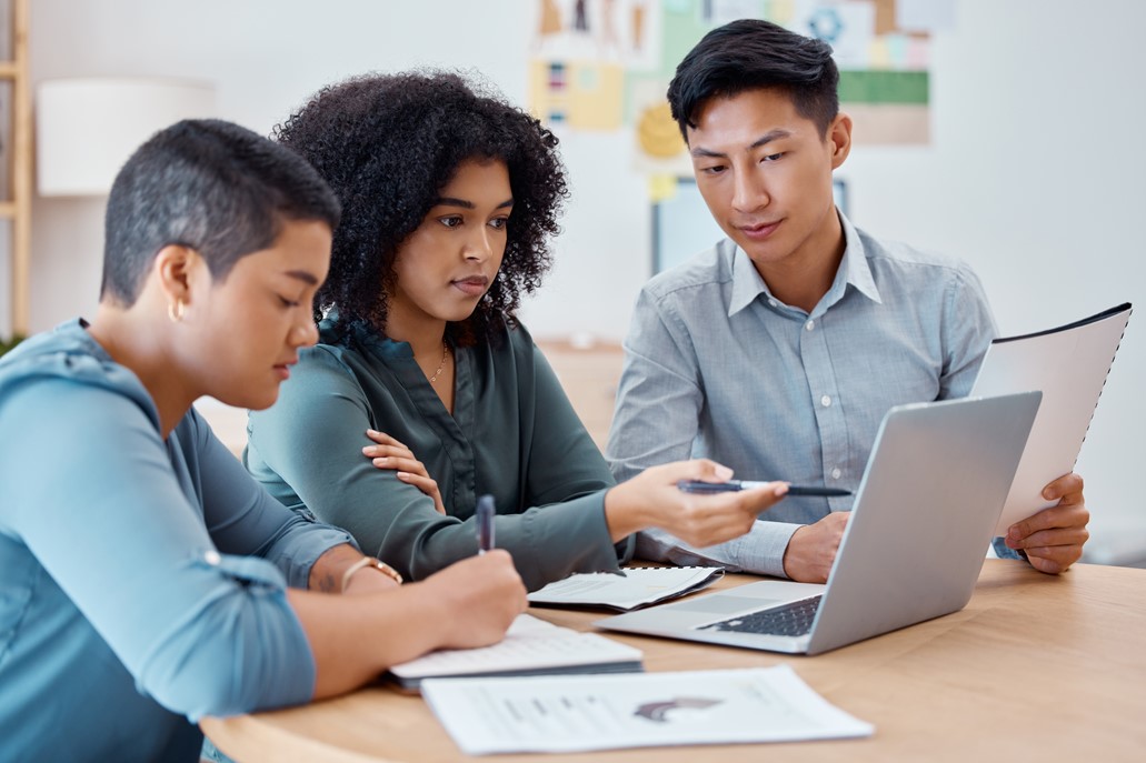 Three workmates analyzing reporting data